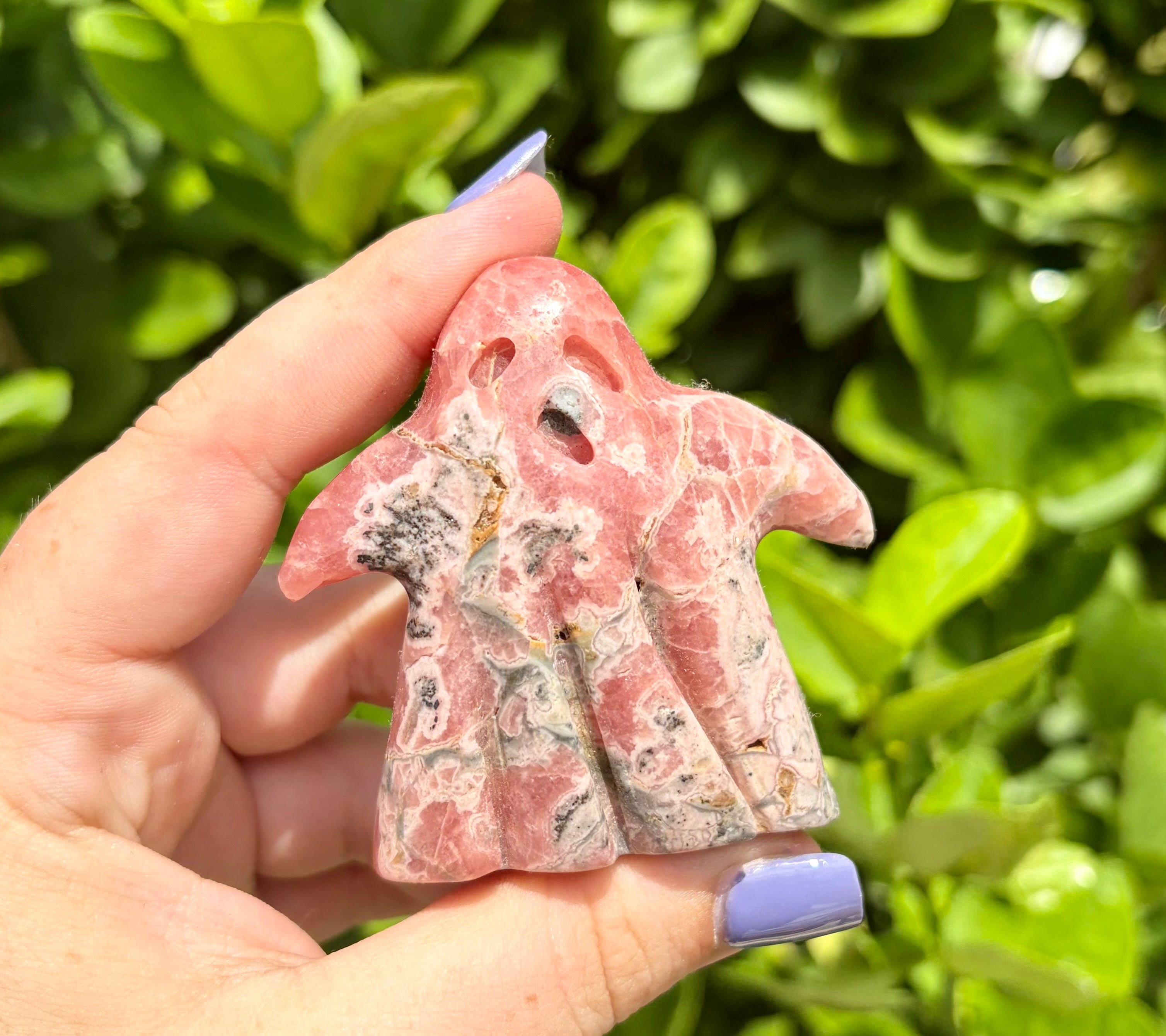 Rhodochrosite ghost carving