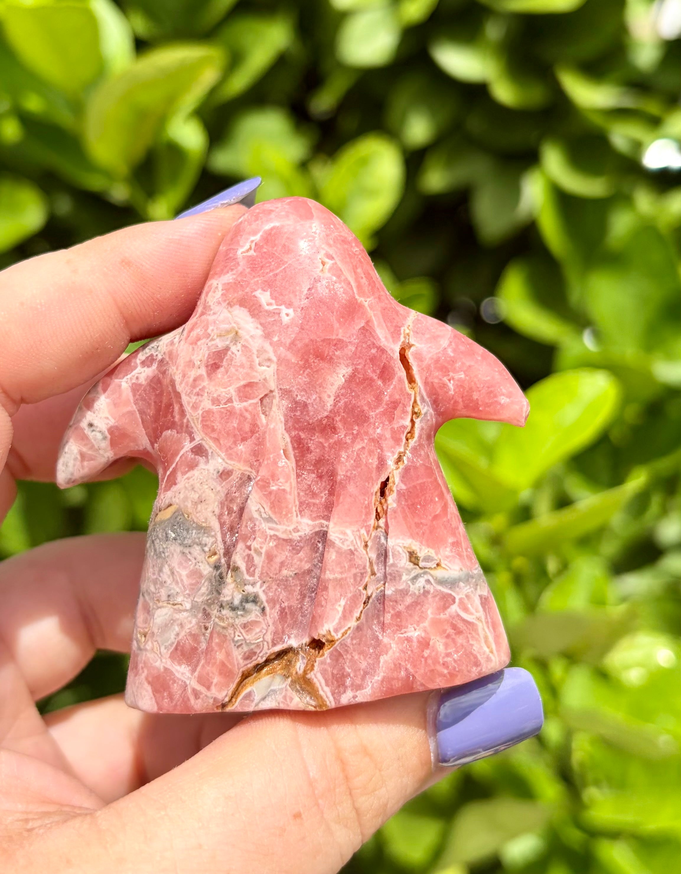 Rhodochrosite ghost carving