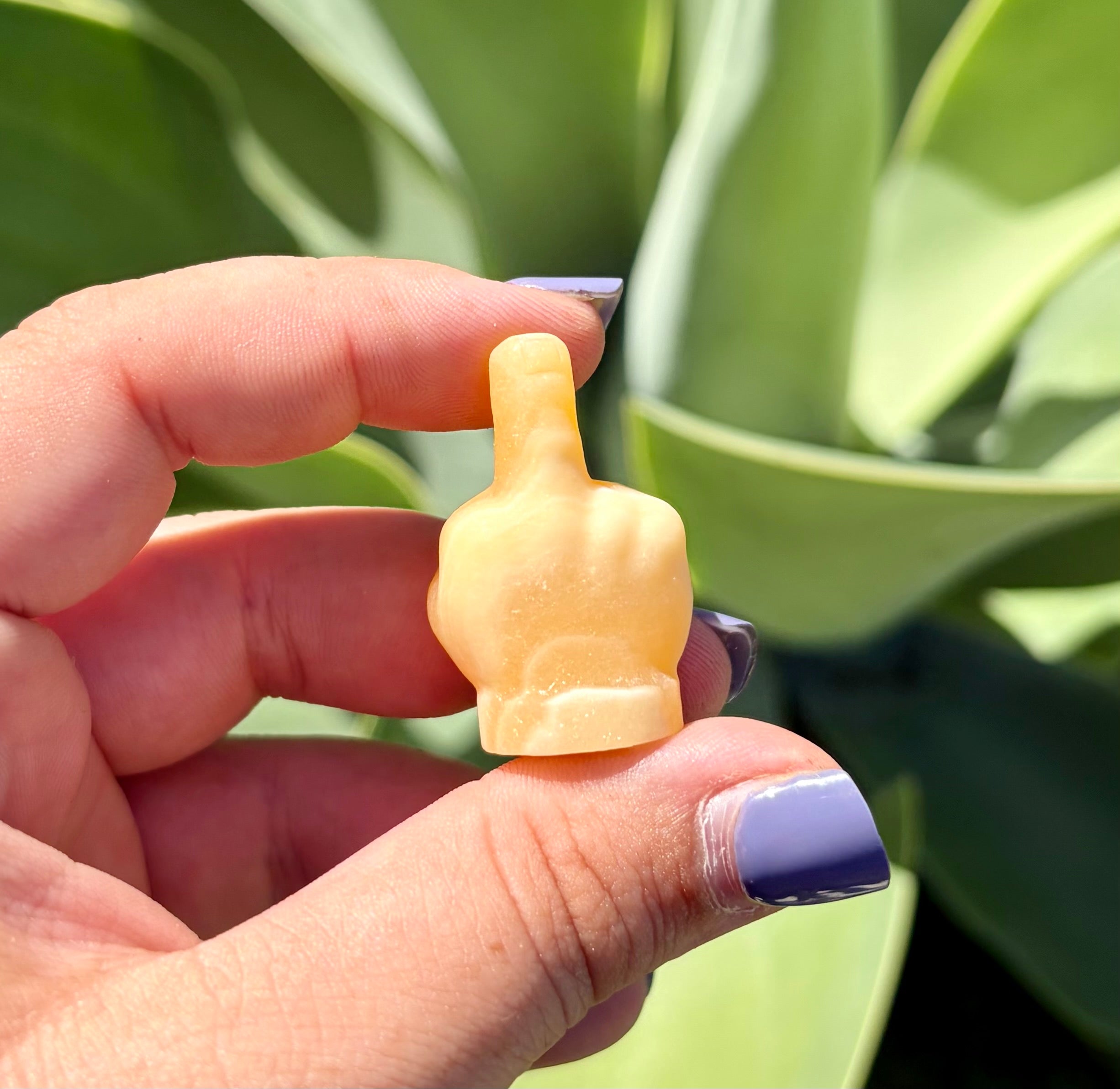 Yellow calcite middle finger